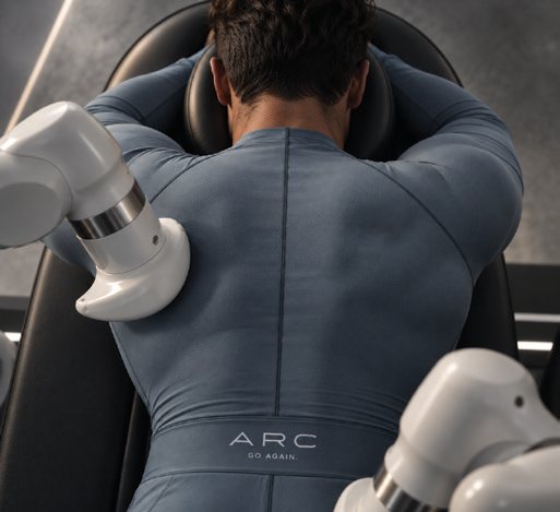 A recovery arm’s end-effector pressing into a Member’s back.